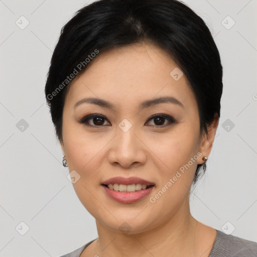 Joyful asian young-adult female with short  black hair and brown eyes