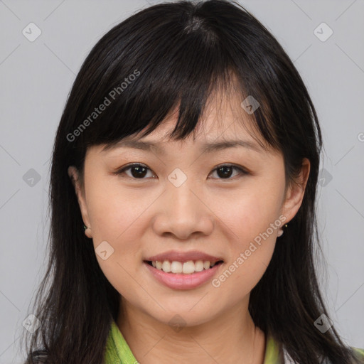 Joyful asian young-adult female with medium  brown hair and brown eyes