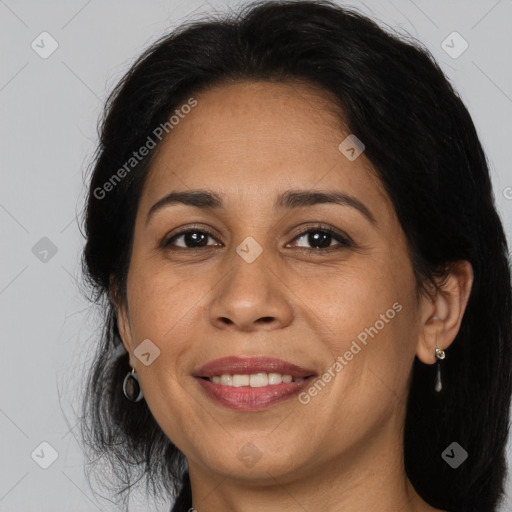 Joyful white adult female with long  brown hair and brown eyes