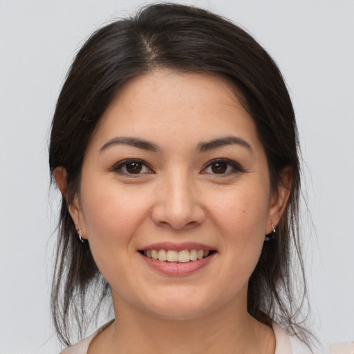 Joyful white young-adult female with medium  brown hair and brown eyes