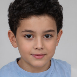 Joyful white child male with short  brown hair and brown eyes