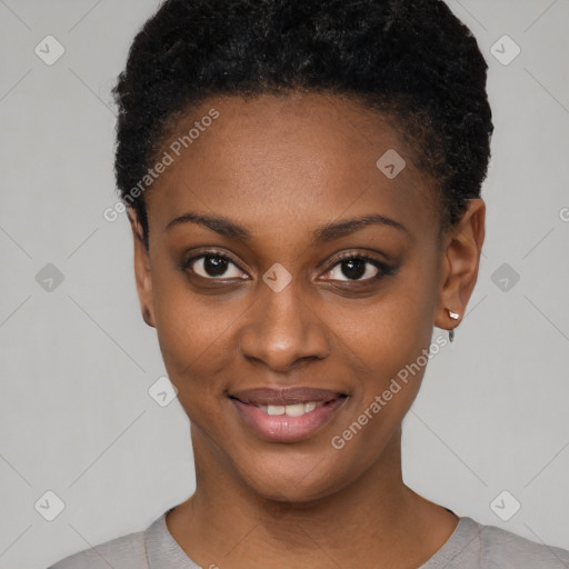 Joyful black young-adult female with short  black hair and brown eyes