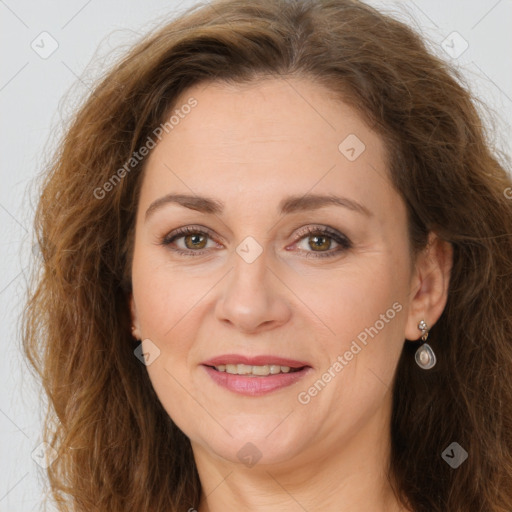 Joyful white adult female with long  brown hair and brown eyes