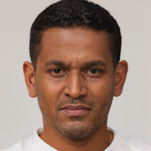 Neutral latino adult male with short  brown hair and brown eyes