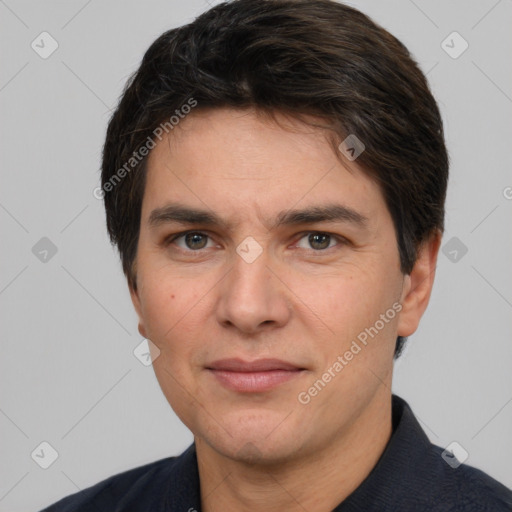 Joyful white adult male with short  brown hair and brown eyes