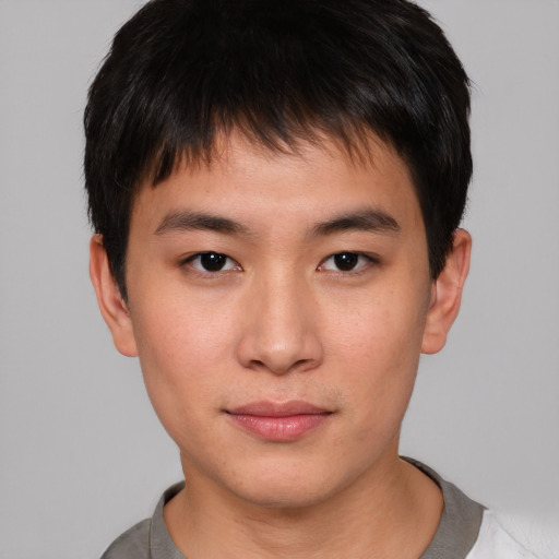 Neutral asian young-adult male with short  brown hair and brown eyes