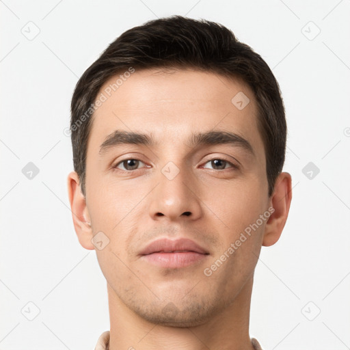 Neutral white young-adult male with short  brown hair and brown eyes