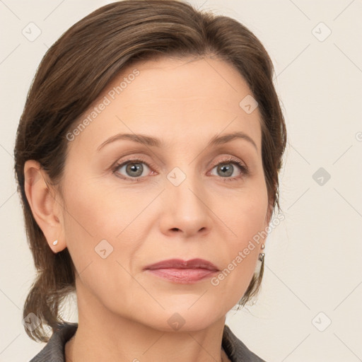 Joyful white adult female with medium  brown hair and grey eyes