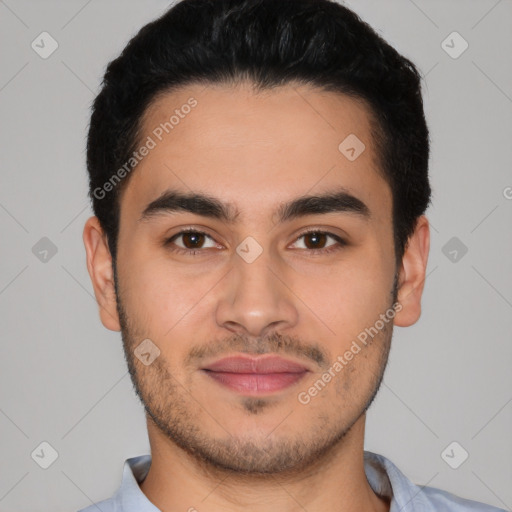 Joyful latino young-adult male with short  black hair and brown eyes