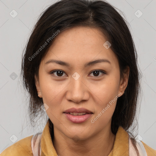 Joyful latino adult female with medium  brown hair and brown eyes