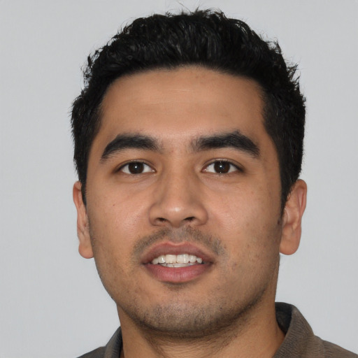 Neutral latino young-adult male with short  black hair and brown eyes