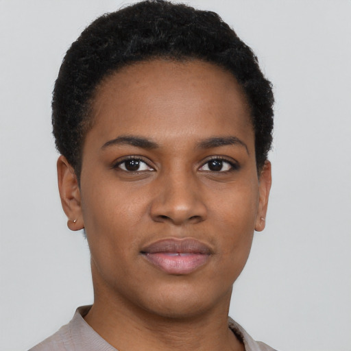 Joyful black young-adult female with short  black hair and brown eyes