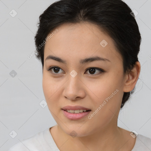 Joyful asian young-adult female with short  brown hair and brown eyes