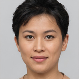 Joyful asian young-adult female with short  brown hair and brown eyes