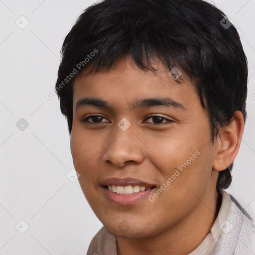 Joyful asian young-adult male with short  black hair and brown eyes