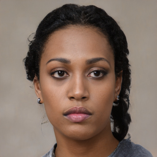 Neutral black young-adult female with medium  black hair and brown eyes