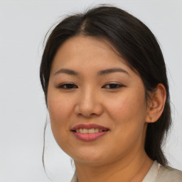 Joyful asian young-adult female with medium  brown hair and brown eyes