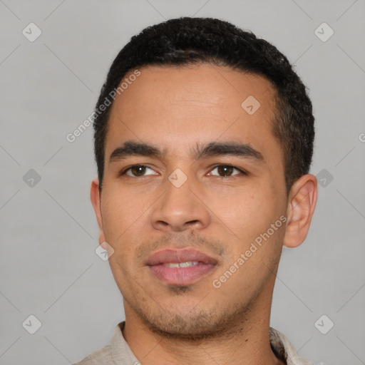 Neutral latino young-adult male with short  black hair and brown eyes