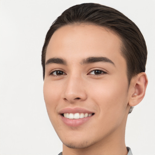 Joyful white young-adult male with short  brown hair and brown eyes