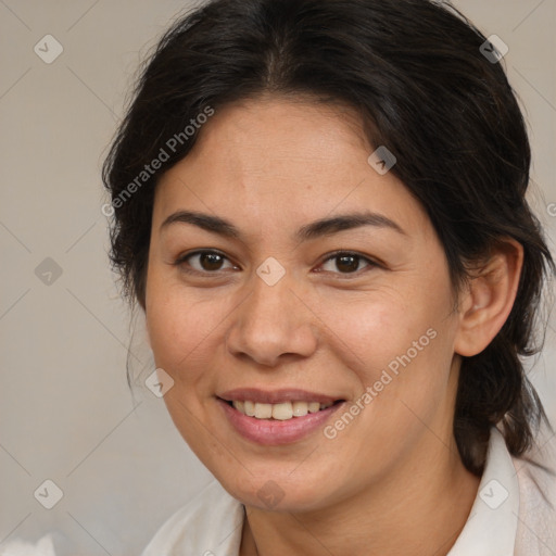 Joyful latino adult female with medium  brown hair and brown eyes