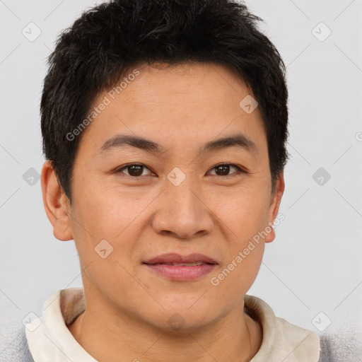 Joyful asian young-adult male with short  brown hair and brown eyes