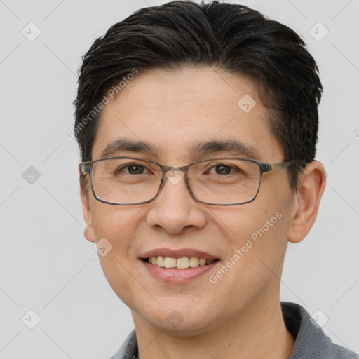 Joyful white adult male with short  brown hair and brown eyes