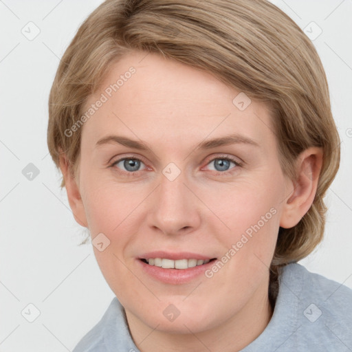 Joyful white young-adult female with medium  brown hair and blue eyes