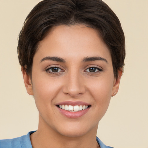 Joyful white young-adult female with short  brown hair and brown eyes