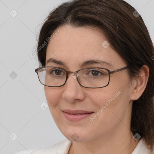 Joyful white adult female with medium  brown hair and brown eyes