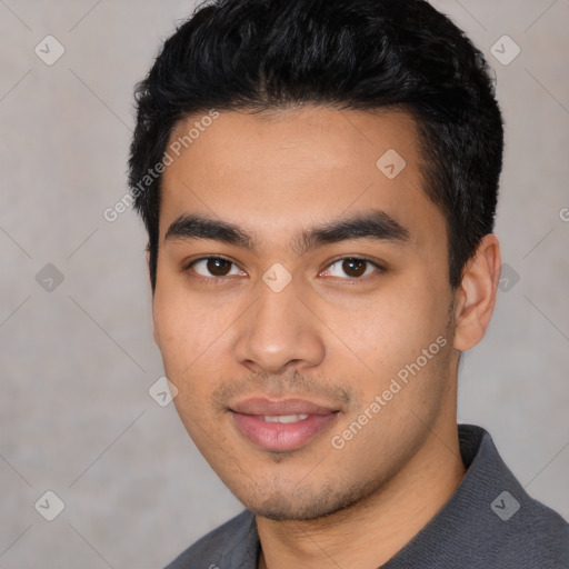 Joyful latino young-adult male with short  black hair and brown eyes