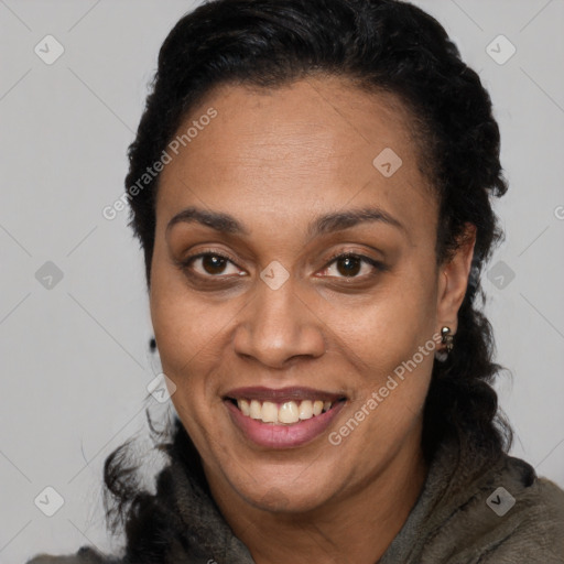 Joyful black adult female with short  brown hair and brown eyes