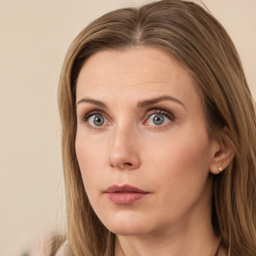 Neutral white young-adult female with long  brown hair and brown eyes