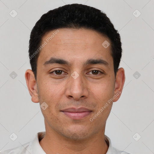 Joyful white young-adult male with short  black hair and brown eyes