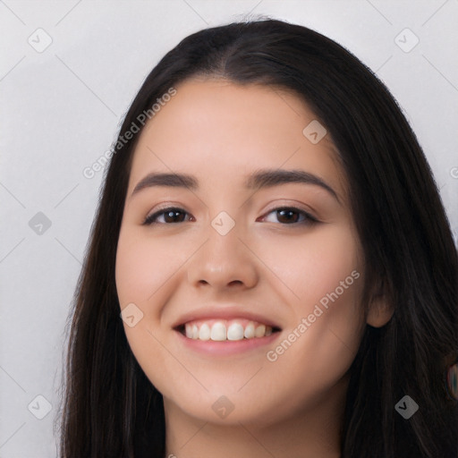 Joyful white young-adult female with long  black hair and brown eyes