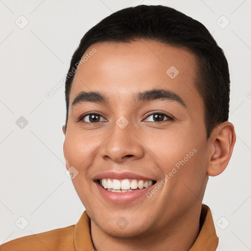 Joyful white young-adult male with short  brown hair and brown eyes