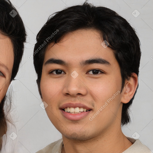 Joyful asian young-adult male with medium  brown hair and brown eyes