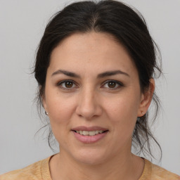 Joyful white young-adult female with medium  brown hair and brown eyes