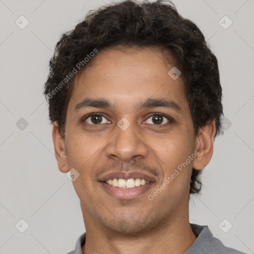 Joyful latino young-adult male with short  brown hair and brown eyes