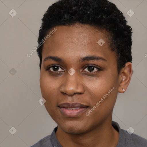 Joyful black young-adult female with short  black hair and brown eyes