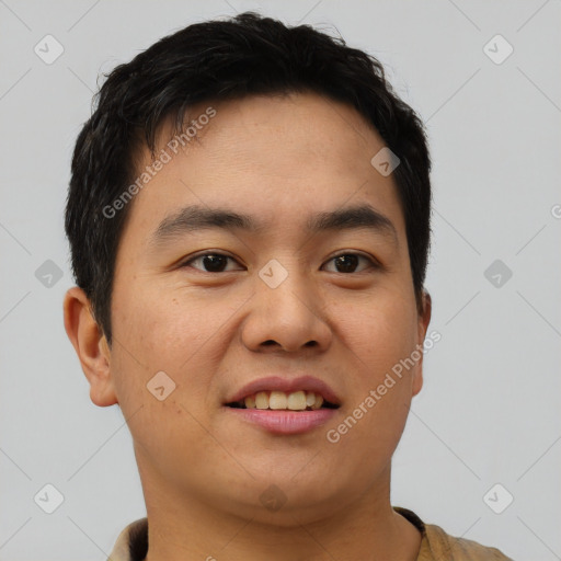 Joyful asian young-adult male with short  brown hair and brown eyes