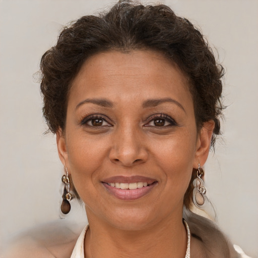 Joyful white adult female with short  brown hair and brown eyes