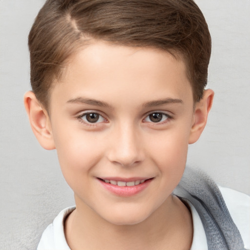 Joyful white child female with short  brown hair and brown eyes