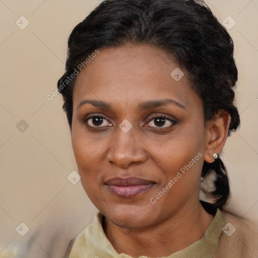 Joyful black adult female with short  brown hair and brown eyes