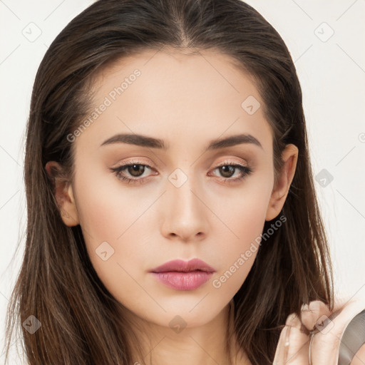 Neutral white young-adult female with long  brown hair and brown eyes