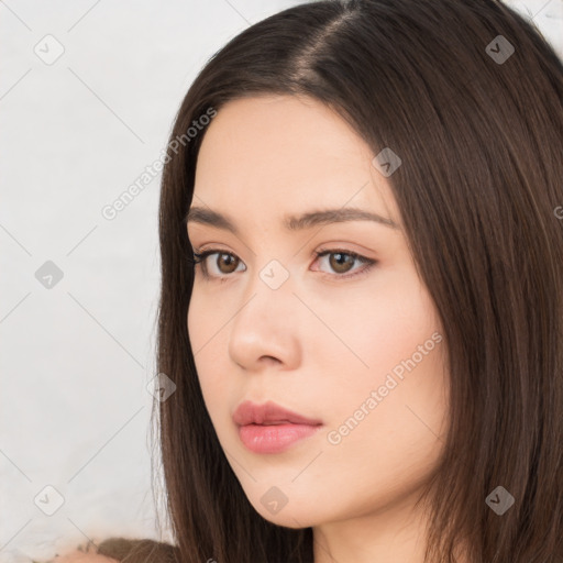 Neutral white young-adult female with long  brown hair and brown eyes