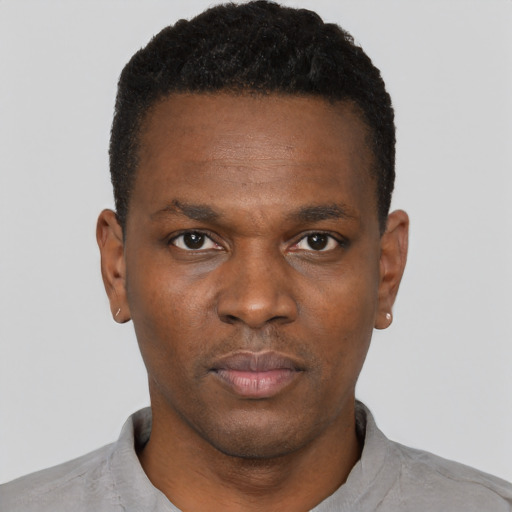 Neutral black young-adult male with short  black hair and brown eyes