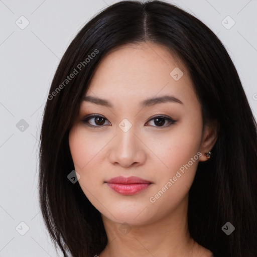 Joyful asian young-adult female with long  brown hair and brown eyes