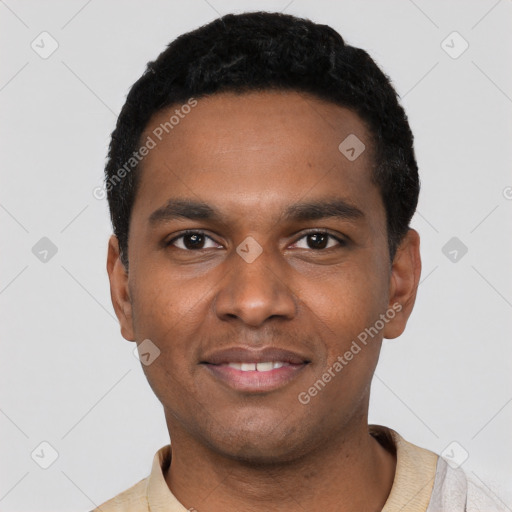 Joyful black young-adult male with short  black hair and brown eyes