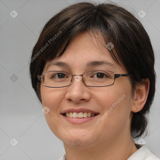 Joyful white adult female with medium  brown hair and brown eyes