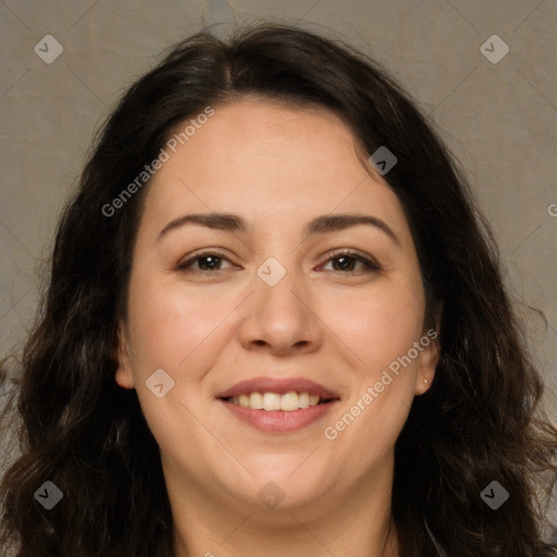 Joyful white adult female with long  brown hair and brown eyes